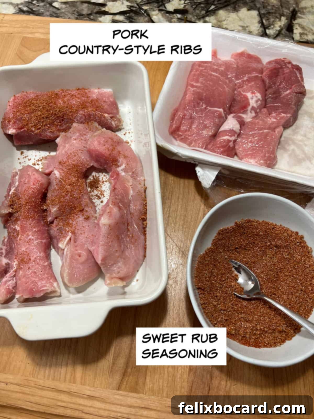 Pork country-style ribs laid out next to a small bowl of seasoning blend, ready for preparation.