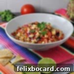 Tropical Heat Salsa 8 pineapple habanero salsa in a serving bowl sitting on a Mexican table runner