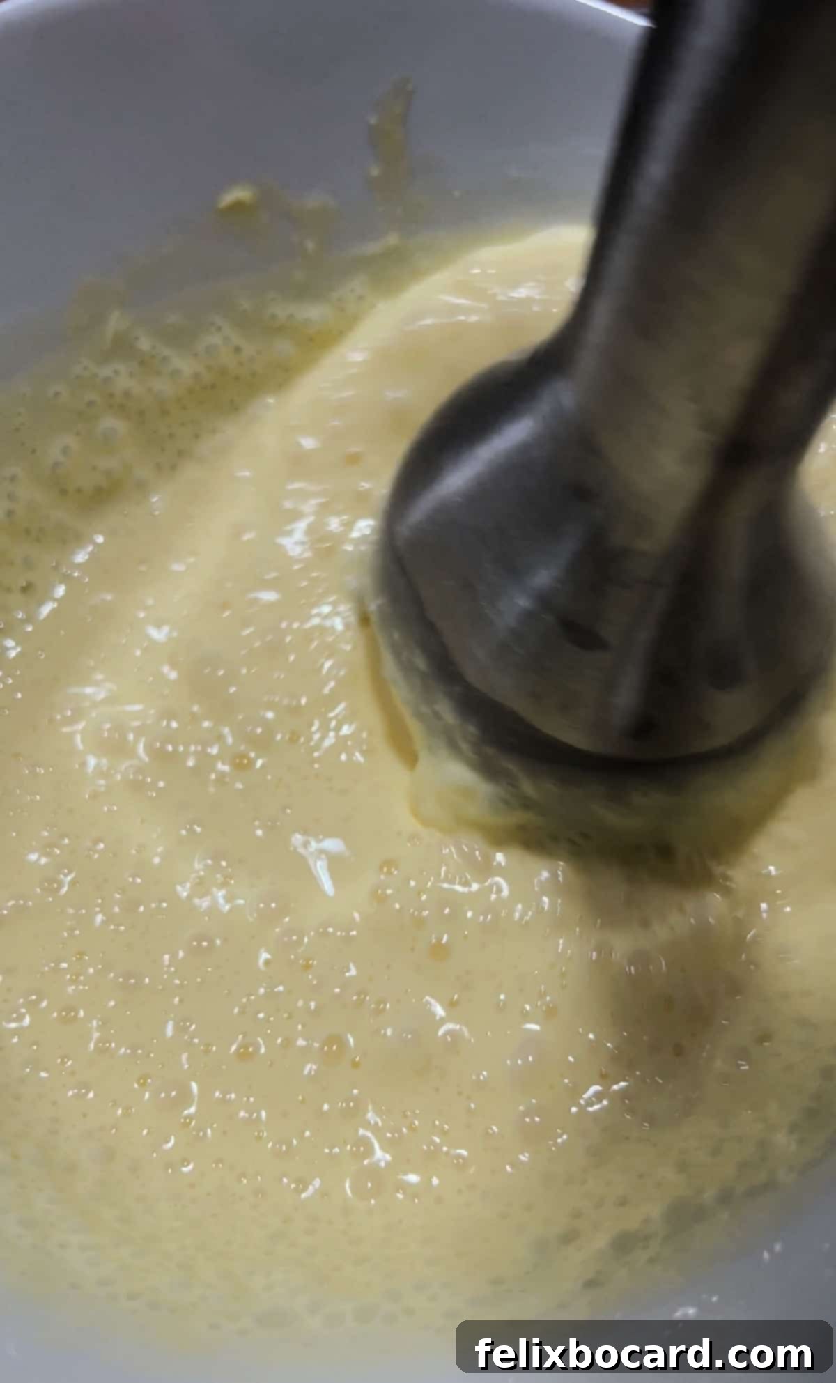 immersion blender mixing batter.