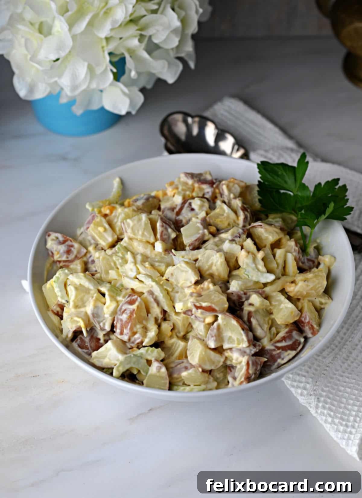 Creamy Red Potato Salad 11 Red skin potato salad in a serving bowl.