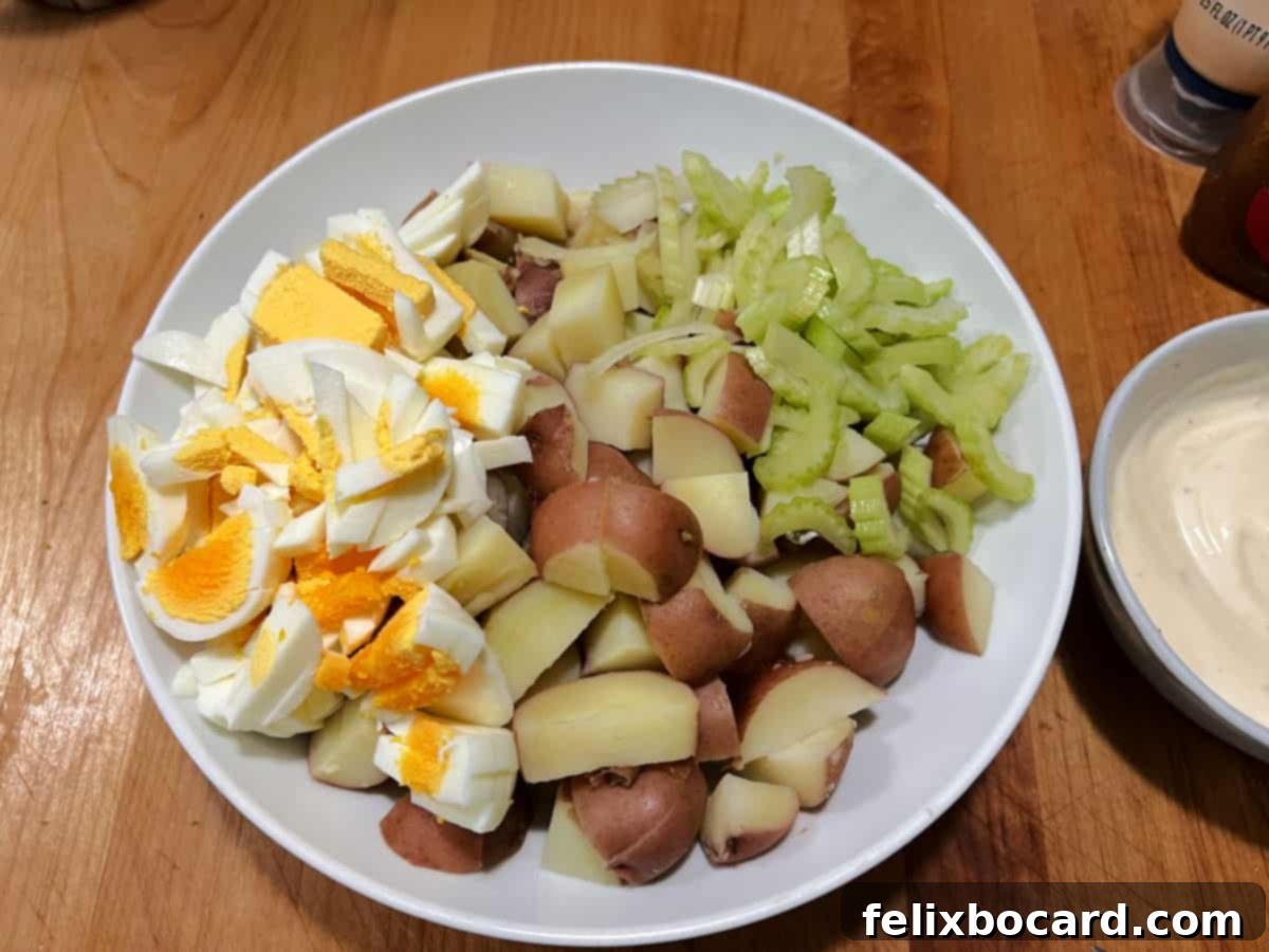 Creamy Red Potato Salad 8 Ingredients in bowl before adding dressing.