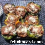 grilled stuffed peppers in a grill basket