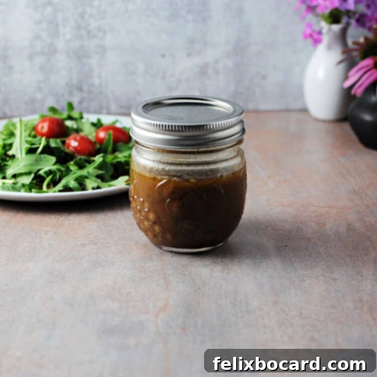 Elevate Your Salad with Homemade Balsamic Vinaigrette 8 Homemade balsamic vinaigrette dressing in a small glass jar, ready for storage in the refrigerator.