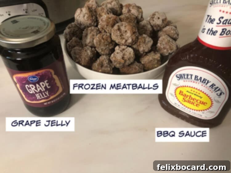 The three essential ingredients for Grape Jelly BBQ Meatballs: a bag of frozen meatballs, a bottle of classic BBQ sauce, and a jar of sweet grape jelly, laid out on a kitchen counter.