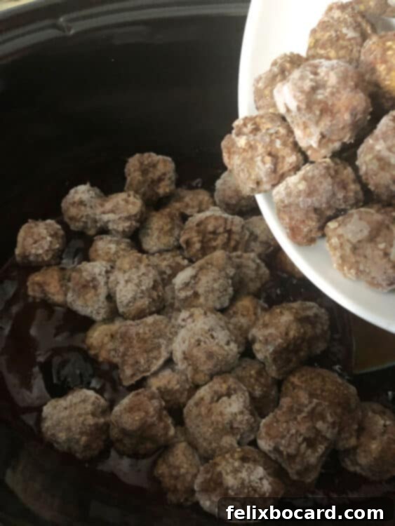 A bag of frozen meatballs being emptied into a slow cooker, joining the grape jelly and BBQ sauce.