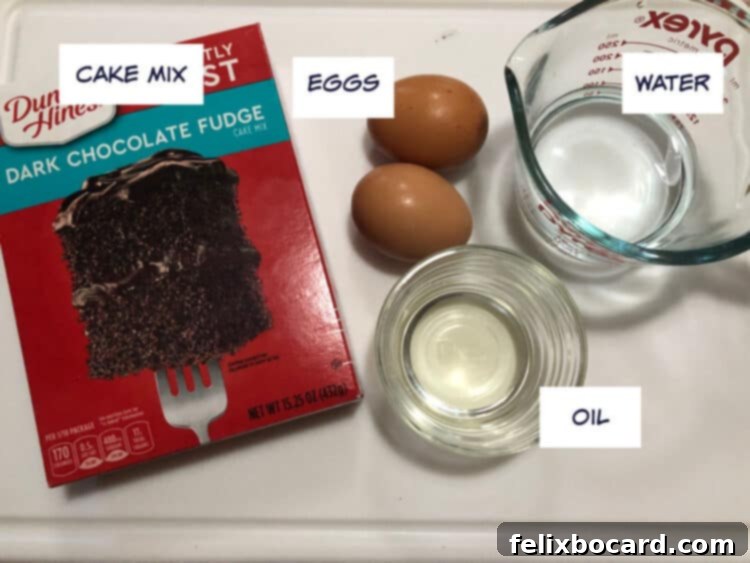 Key ingredients for quick cake mix waffles: a box of cake mix, fresh eggs, cooking oil, and water, neatly arranged for easy baking.