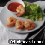 Crispy Air Fryer Coconut Shrimp 6 Crispy air fryer coconut shrimp served on a small plate with dipping sauce