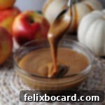 Instant Pot Dulce de Leche 9 instant pot caramel sauce dripping from a spoon into a bowl