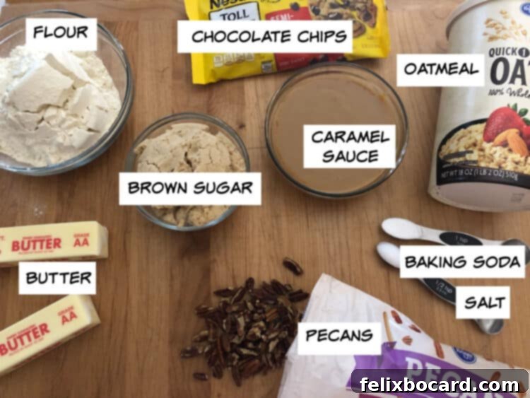 Key ingredients laid out: flour, chocolate chips, oatmeal, dulce de leche sauce, baking powder, salt, pecans, brown sugar, butter