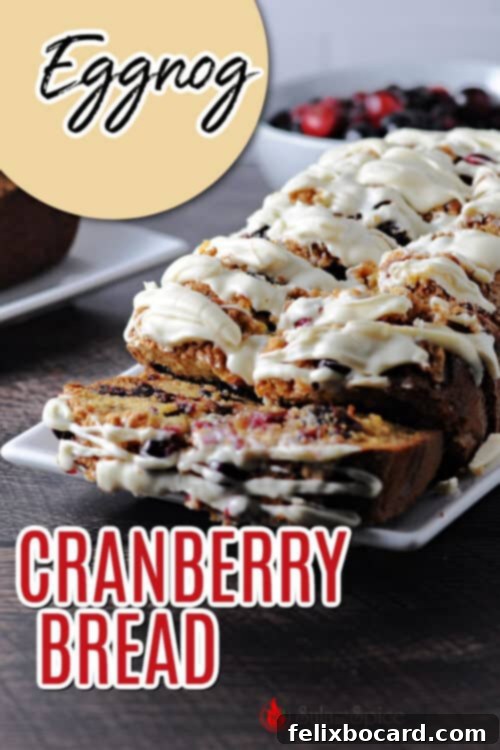 A vertical image of a slice of Eggnog Cranberry Bread with white chocolate, perfect for pinning on Pinterest.