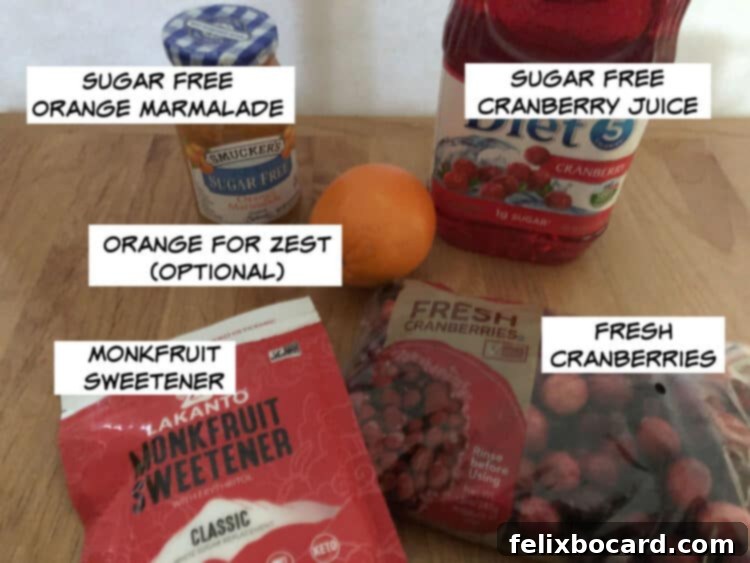 Low-Carb Cranberry Delight 3 ingredients: sugar free orange marmalade, sugar free cranberry juice, fresh cranberries, monkfruit sweetener, and optional orange for zest