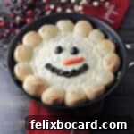warm snowman dip served in a skillet