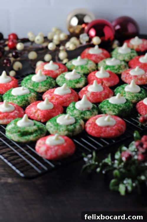 Delicate Sugar Blooms 2 Festive Sugar Cookie Blossoms adorned with red and green sprinkles, artfully arranged on a large holiday tray, ready for celebration.