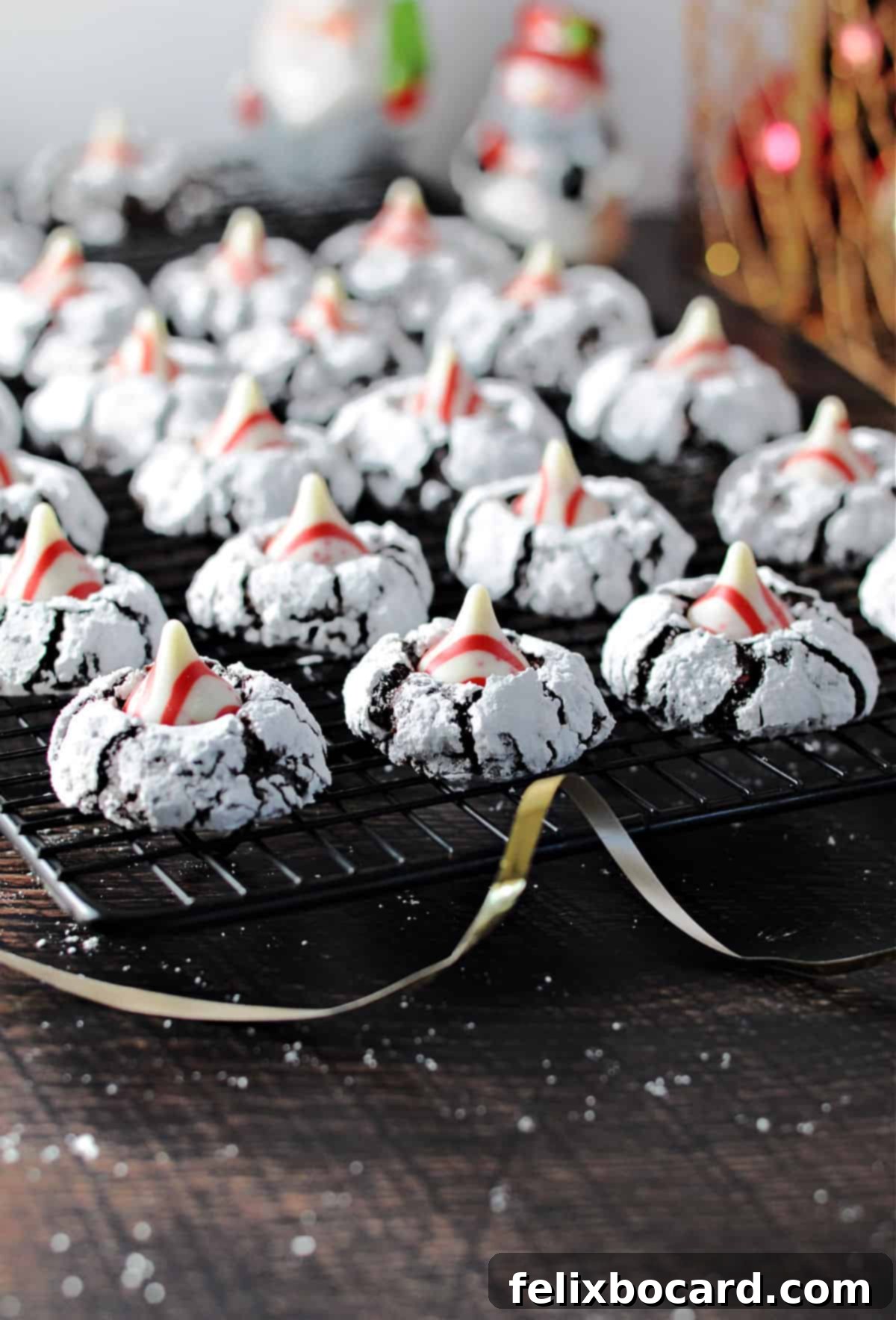 Peppermint Chocolate Kiss Cookies 7 chocolate peppermint kiss cookies cooling on a rack.