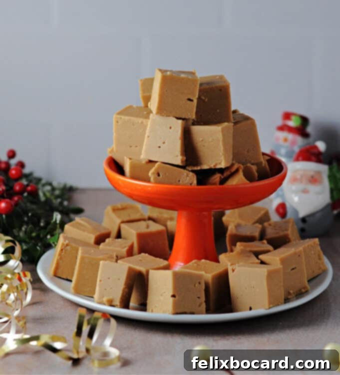 Spiced Speculoos Fudge 2 biscoff fudge stacked on a plate and small platform