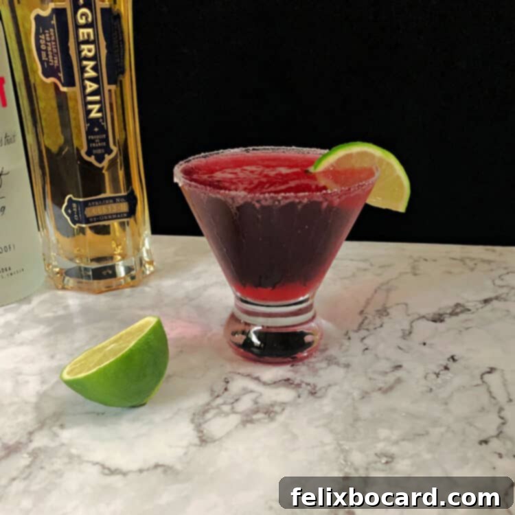 Cranberry Grapefruit Cocktail in a glass garnished with lime