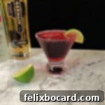 Cranberry Grapefruit Cocktail in a glass garnished with lime