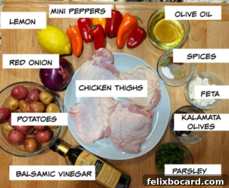 A vibrant collection of fresh ingredients laid out: chicken thighs, red and yellow bell peppers, red onion, baby potatoes, a whole lemon, olive oil, balsamic vinegar, and a selection of dried Mediterranean spices including tarragon, oregano, and smoked paprika. Crumbled feta, Kalamata olives, and fresh parsley are also visible for garnish.