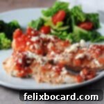 Mediterranean Feta Chicken Tenders 9 baked feta chicken tenderloins on a plate