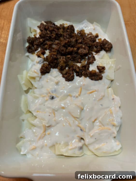 adding beef to baking dish