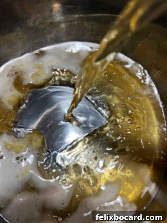 Beer pouring into Instant Pot.