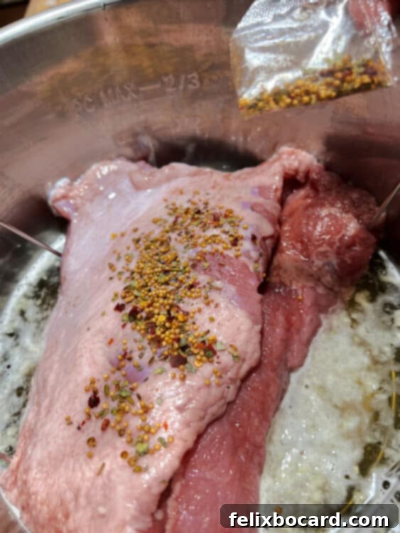 raw corned beef in trivet in Instant Pot.