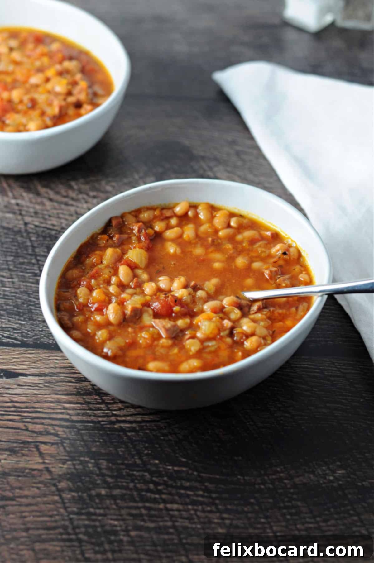 Hearty Instant Pot Ham and Navy Bean Soup 9 bowl of navy bean with ham soup made in the instant pot.