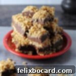 red plate with a stack of chocolate peanut butter oatmeal bars