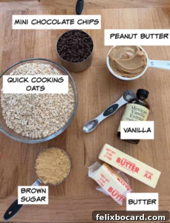 A flat lay image of ingredients for no-bake chocolate peanut butter oatmeal bars, including oats, chocolate chips, peanut butter, vanilla extract, butter, and brown sugar.