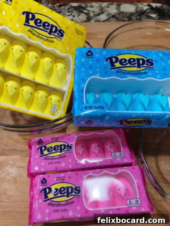 3 packages of Peeps, blue, pink, and yellow chicks