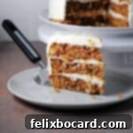 a slice of old fashioned carrot cake with pineapple on a small plate.