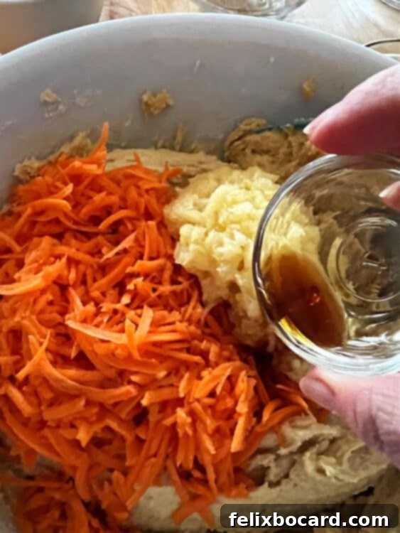 adding carrots pineapple and vanilla to the batter.