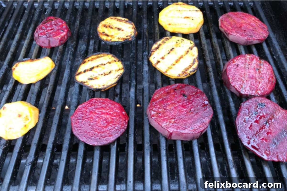 slices of red and golden beet cooking on a grill