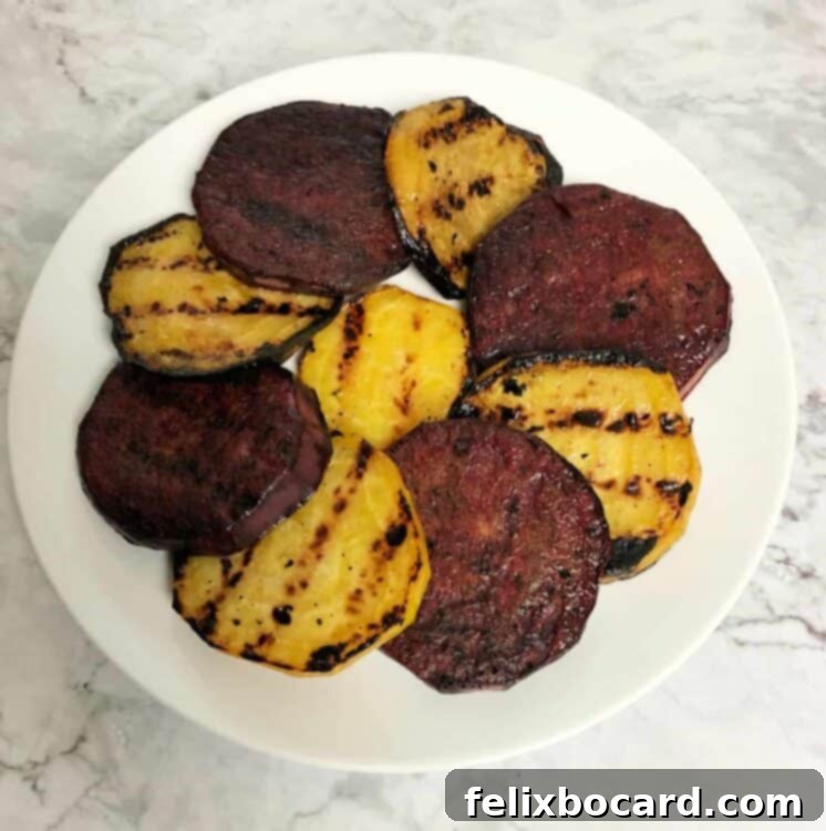 grilled red and golden beets on a white plate
