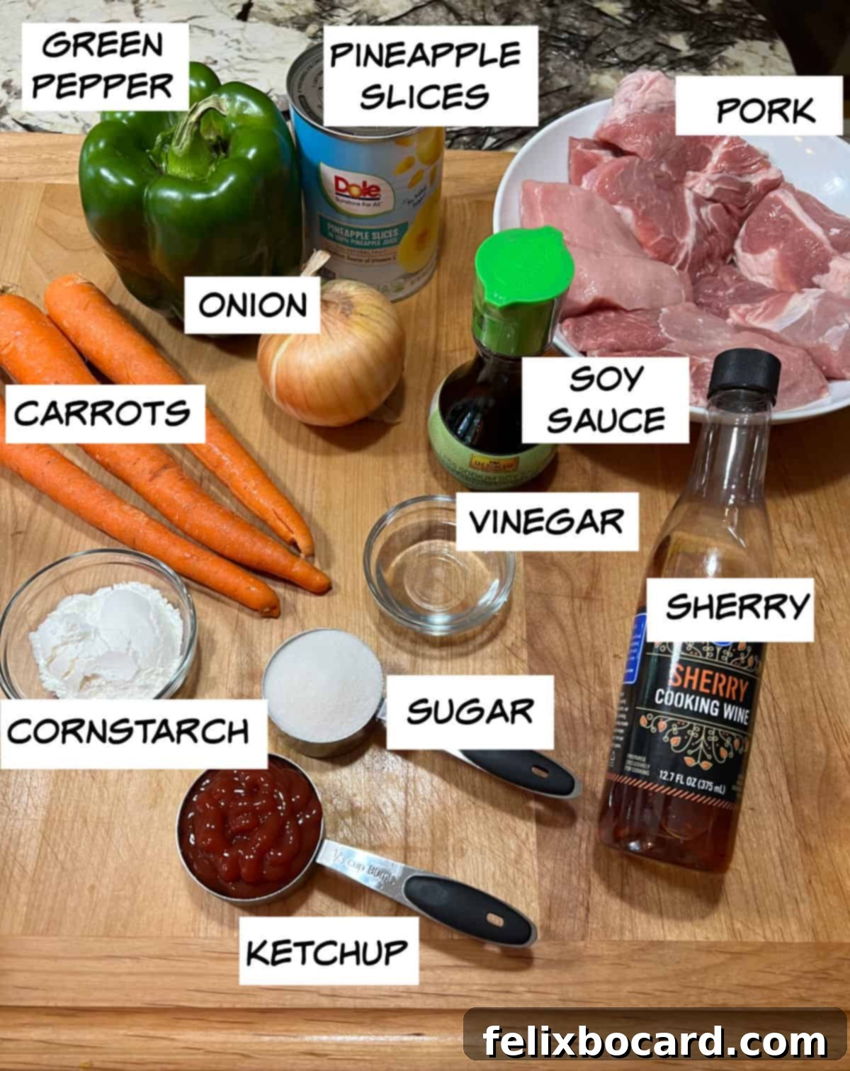 Ingredients for sweet and sour pork kabobs: pork, soy sauce, vinegar, sherry, sugar, ketchup, cornstarch, carrots, onion, green pepper, pineapple.
