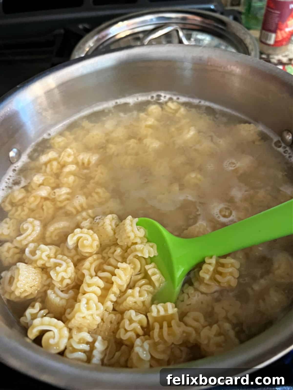 Radiatore pasta boiling in a pot of water.