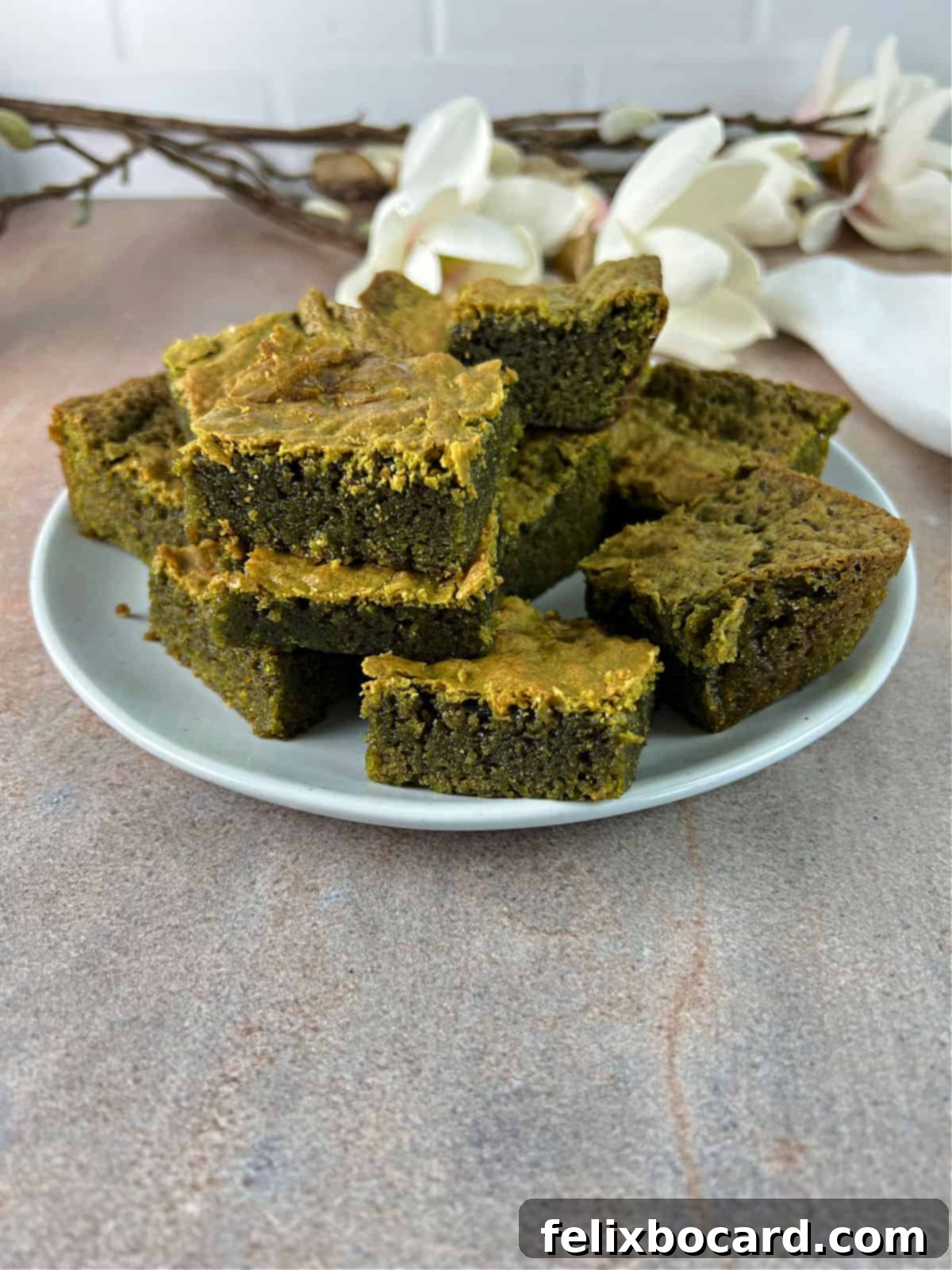 stack of matcha brownies on a plate