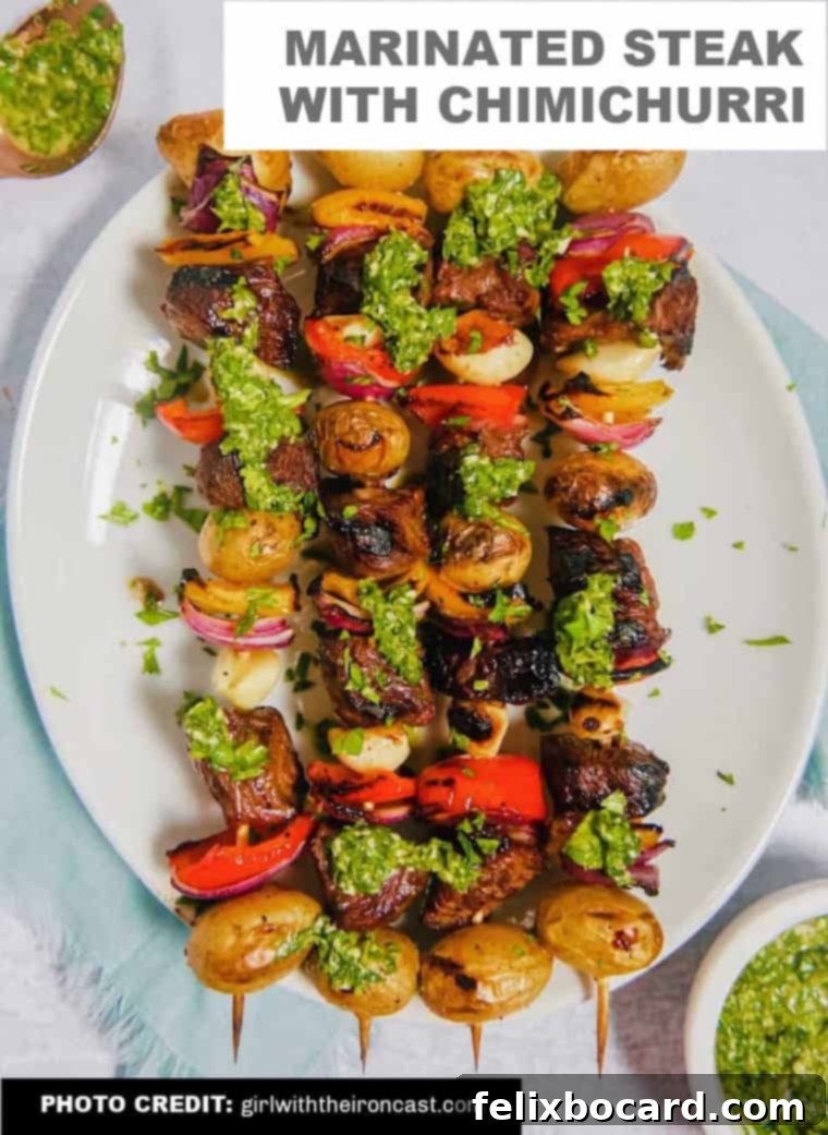 Marinated sirloin steak skewers with baby potatoes, bell peppers, and red onion, topped with fresh chimichurri sauce.