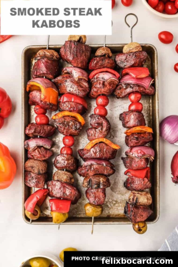 Amazing smoked steak kabobs featuring marinated sirloin, red onion, cherry tomatoes, olives, mushrooms, and bell peppers.