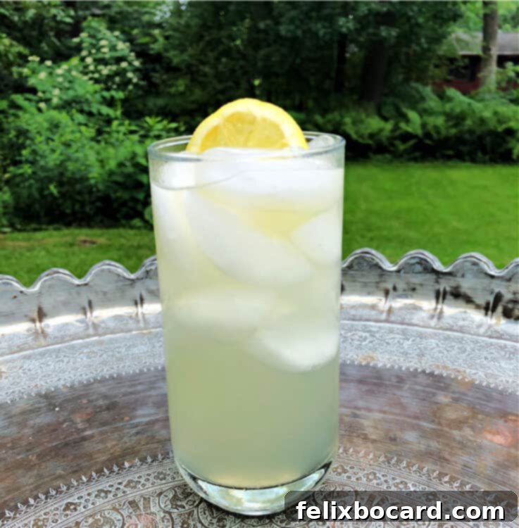 A refreshing glass of lemonade sitting on a table outdoors, perfect for a hot summer day.