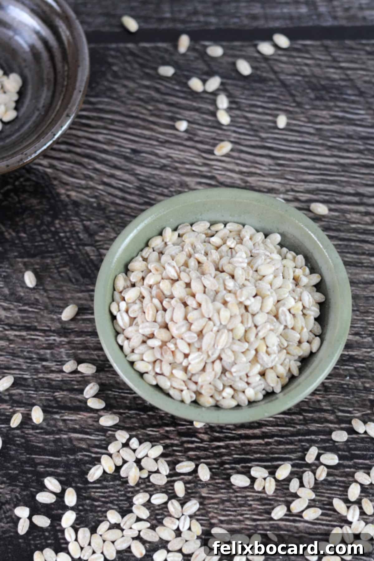Small bowl of pearled barley grains.