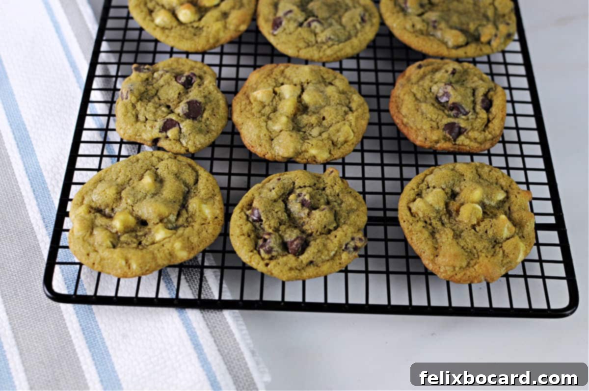 Matcha chocolate chip cookies cooling on a wire rack.