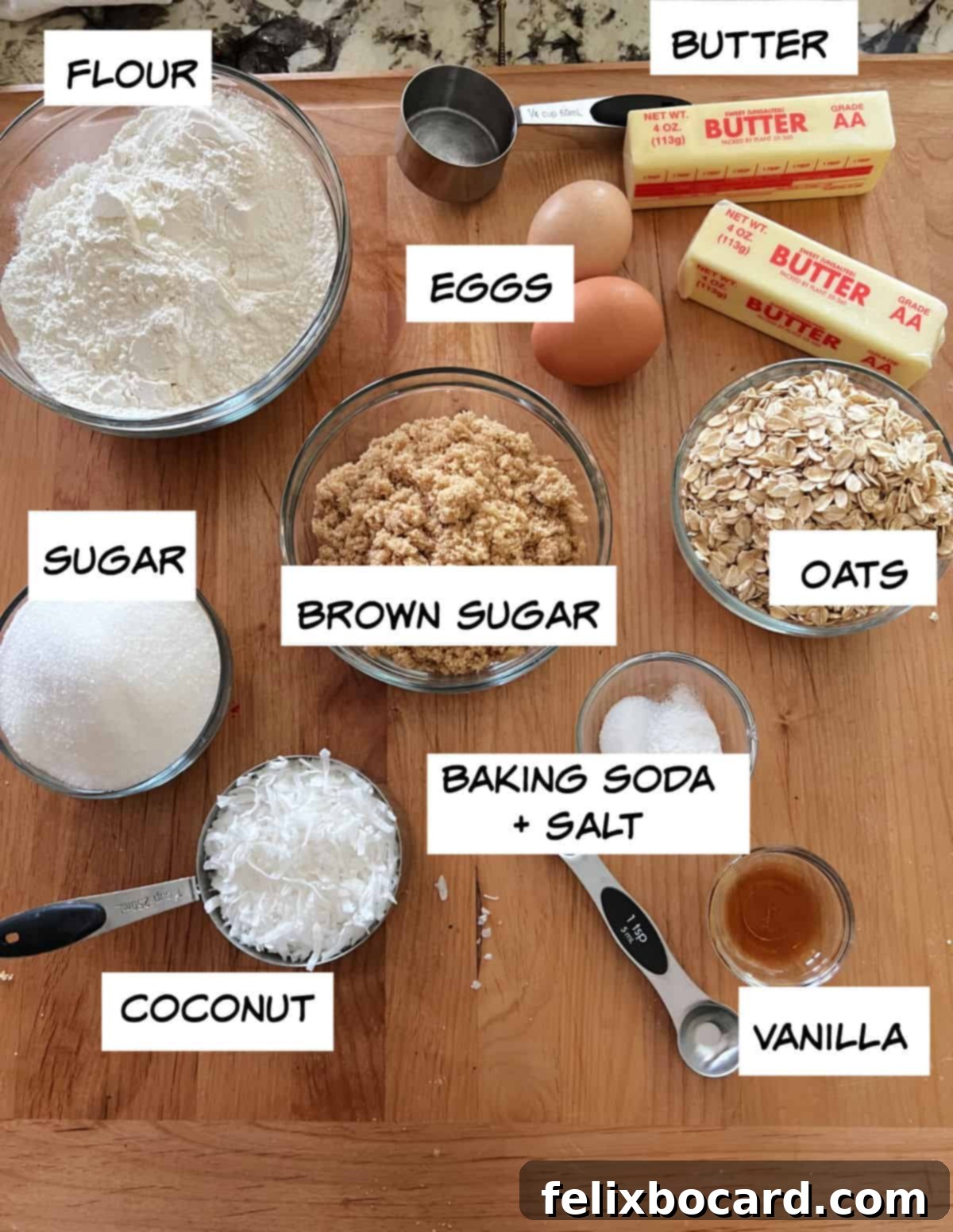 A selection of ingredients laid out for baking oatmeal coconut cookies.