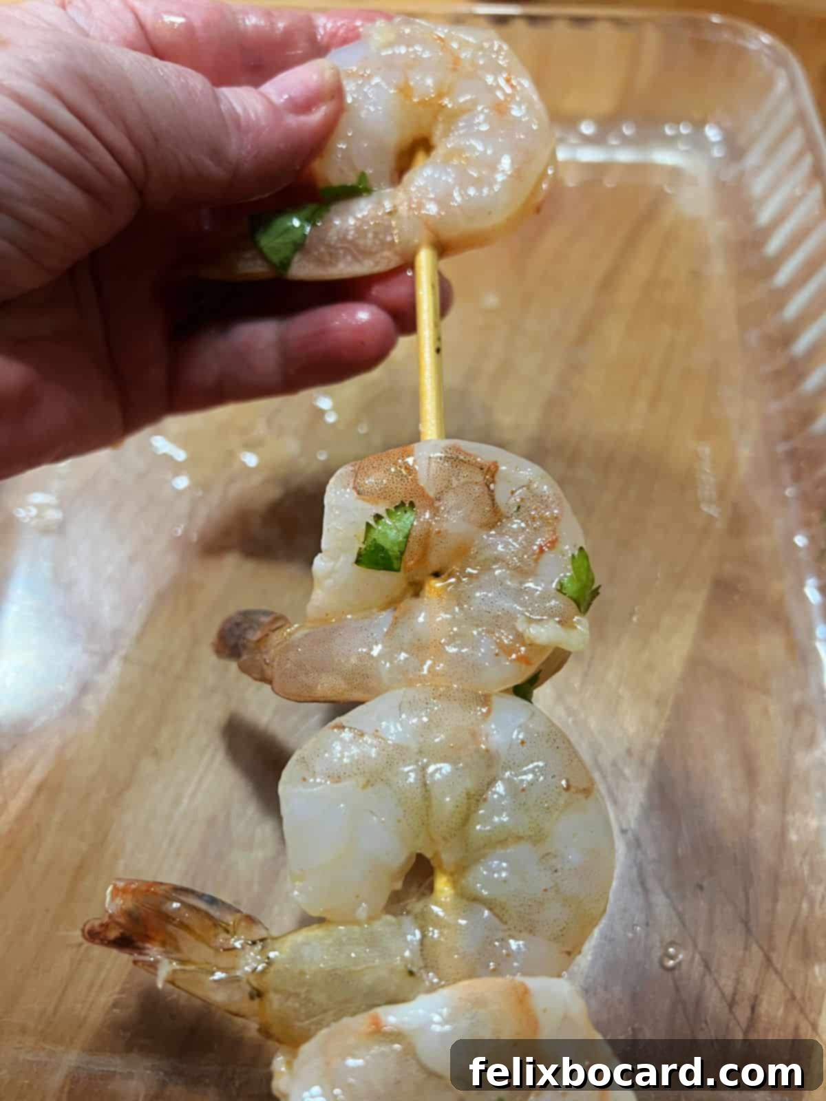 Fiesta Lime Grilled Shrimp Skewers 6 Threading shrimp onto a bamboo skewer.