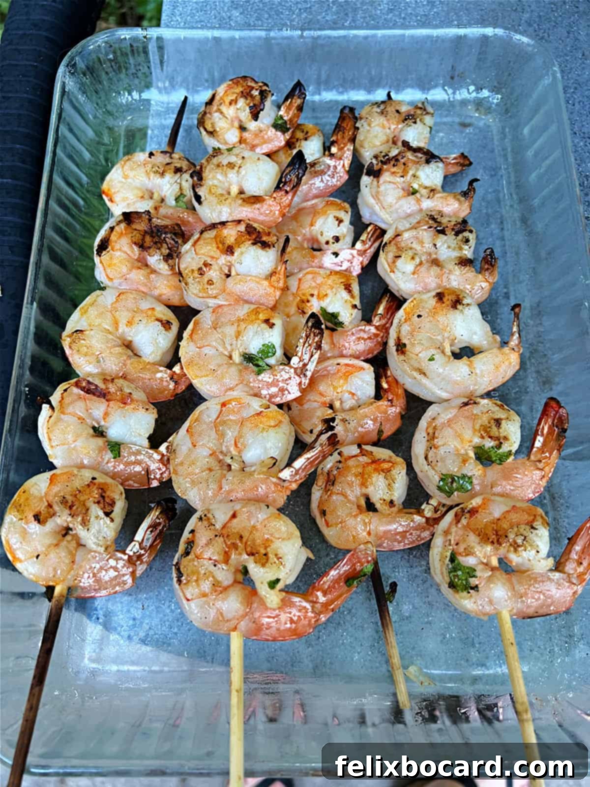 Fiesta Lime Grilled Shrimp Skewers 8 Cooked shrimp skewers removed from the grill.