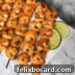 Fiesta Lime Grilled Shrimp Skewers 10 close up of shrimp skewers on a rectangular platter