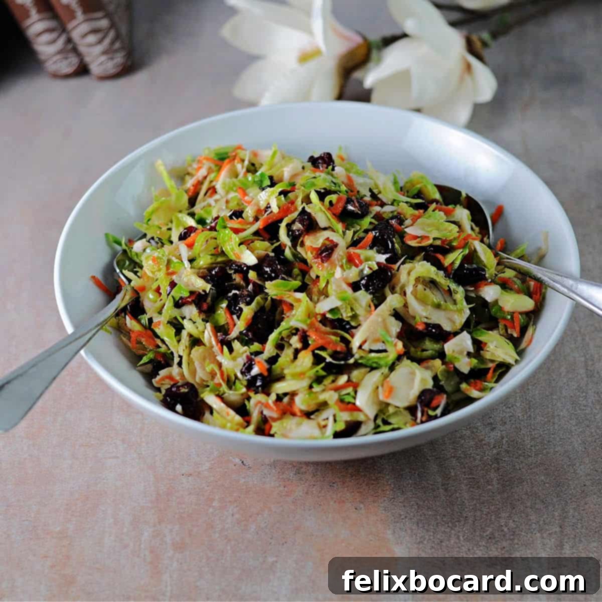 Brussels Sprouts and Cranberry Salad 8 A beautifully presented serving bowl of Brussels sprouts salad with cranberries and carrots, ready for guests.
