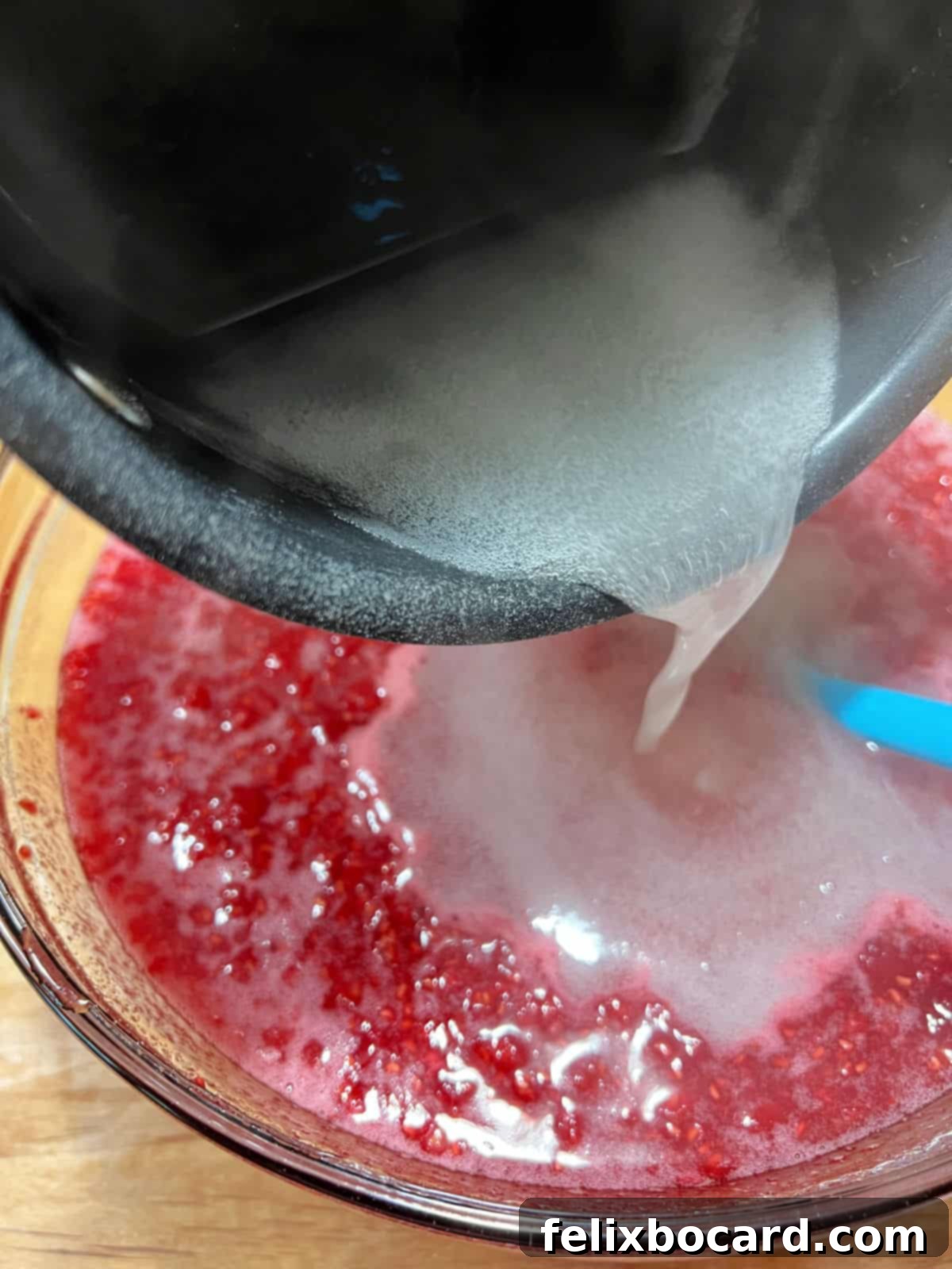 pouring pectin over berries.