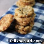 Chocolate Chip Cookies with a Crispy Secret 7 stack of oatmeal rice krispie cookies on a blue and white checkered towel.