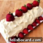 Strawberry Shortcake Swirl 8 frosted strawberry shortcake roll garnished with fresh strawberries